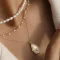 Encircling Elegance: The Timeless Charm and Subtle Power of Necklaces